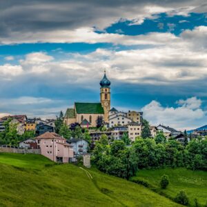 Alpine Village with Church Tower – Heart of the Hills-min
